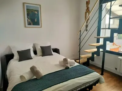 Un ou plusieurs lits dans un hébergement de l'établissement Maison chaleureuse près Disney