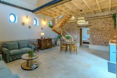 Coin salon dans l'établissement La Bergerie des 2 Tilleuls - Maison avec jacuzzi