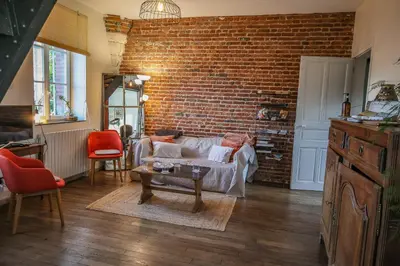 Coin salon dans l'établissement Gîte cosy, champêtre, classé 3 étoiles Le bout du L