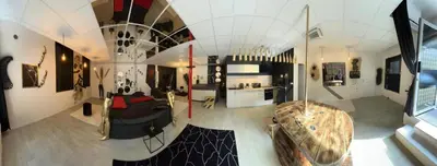 Coin salon dans l'établissement L'escapade sensuelle - la love room d'Epernay