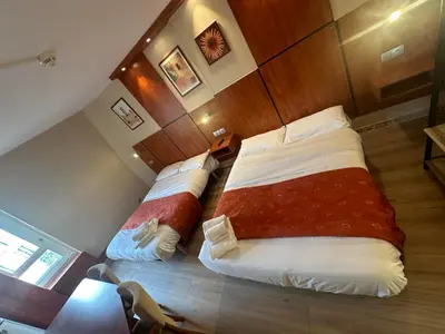 Un ou plusieurs lits dans un hébergement de l'établissement Hôtel Victoria