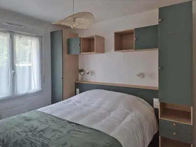 Un ou plusieurs lits dans un hébergement de l'établissement Ticya Lodge - Maison calme, neuve, proche de Disneyland Paris, parking privé