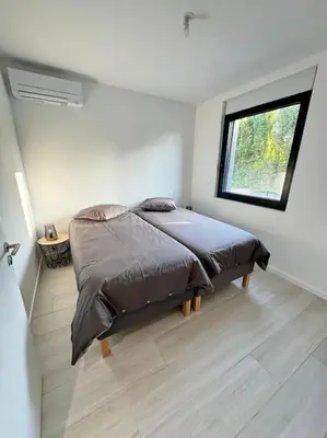 Un ou plusieurs lits dans un hébergement de l'établissement Appartement meublé de 120 m2