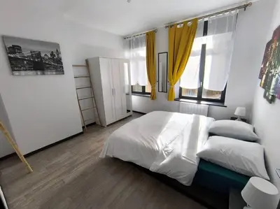 Un ou plusieurs lits dans un hébergement de l'établissement Rivage Ardennais - chateau - CHU -T2-queen size
