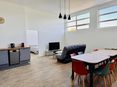 Télévision ou salle de divertissement dans l'établissement Appartement Magnum