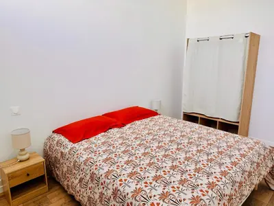 Un ou plusieurs lits dans un hébergement de l'établissement Appartement Magnum