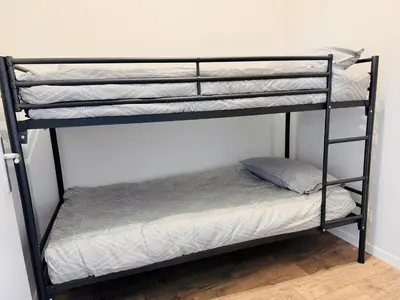 Un ou plusieurs lits dans un hébergement de l'établissement Appartement Magnum