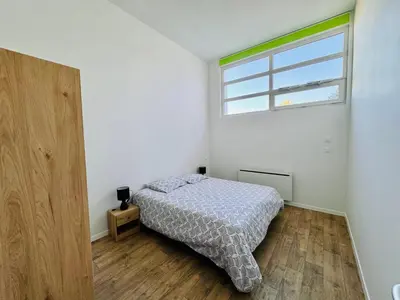Un ou plusieurs lits dans un hébergement de l'établissement Appartement Jéroboam