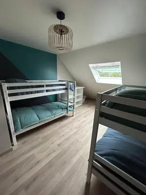 Un ou plusieurs lits dans un hébergement de l'établissement Gîte le Beauchamp