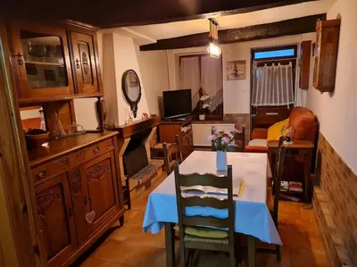 Télévision ou salle de divertissement dans l'établissement La Petite Maison Pa'Meuse