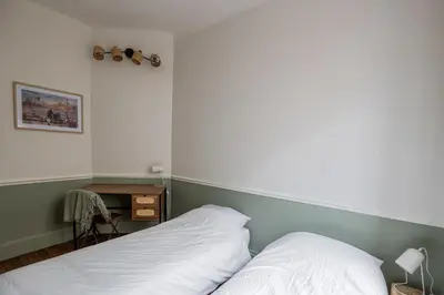 Un ou plusieurs lits dans un hébergement de l'établissement Appart 2 chambres I charmant & cosy I hyper-centre