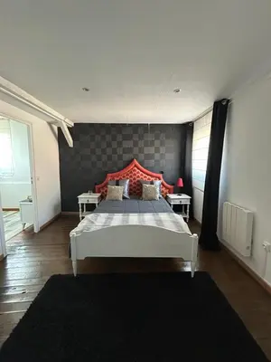 Un ou plusieurs lits dans un hébergement de l'établissement Maison Charmante