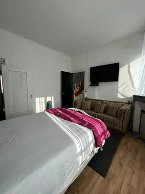 Un ou plusieurs lits dans un hébergement de l'établissement Maison Charmante