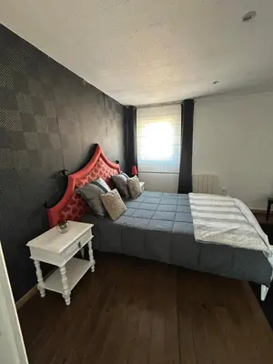 Un ou plusieurs lits dans un hébergement de l'établissement Maison Charmante