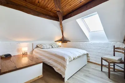Un ou plusieurs lits dans un hébergement de l'établissement Gîte 8 chambres entre Reims et Epernay - La Chenevière - Gîtes Au Beau Sarrazin