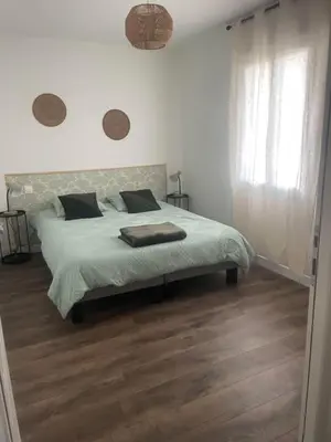 Un ou plusieurs lits dans un hébergement de l'établissement Maison chaleureuse axe Reims-Laon-Soissons