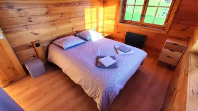 Un ou plusieurs lits dans un hébergement de l'établissement Le chalet de la presle