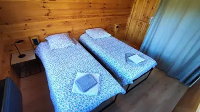 Un ou plusieurs lits dans un hébergement de l'établissement Le chalet de la presle