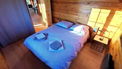 Un ou plusieurs lits dans un hébergement de l'établissement Le chalet de la presle