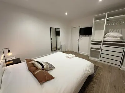 Un ou plusieurs lits dans un hébergement de l'établissement Santa Fe, appartement neuf proche du centre-ville
