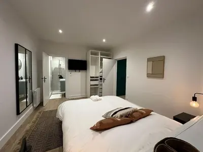 Un ou plusieurs lits dans un hébergement de l'établissement Santa Fe, appartement neuf proche du centre-ville