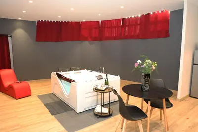 Coin salon dans l'établissement La Suite Romantique