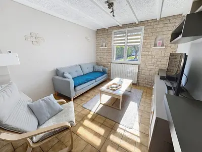 Télévision ou salle de divertissement dans l'établissement Gîte Cosy avec Jardin&Garage privé 10min de Reims