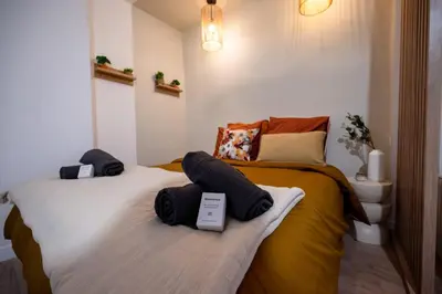 Un ou plusieurs lits dans un hébergement de l'établissement Studio Chic en Plein Centre-Ville