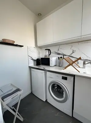 Cuisine ou kitchenette dans l'établissement L'Appartement du Forum - Reims centre Cathédrale