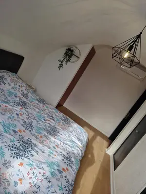 Un ou plusieurs lits dans un hébergement de l'établissement appartement en pleine nature