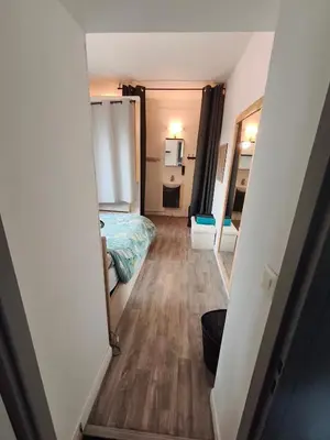 Un ou plusieurs lits dans un hébergement de l'établissement Agréable appartement 