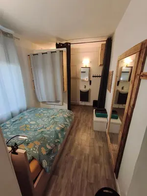 Un ou plusieurs lits dans un hébergement de l'établissement Agréable appartement 