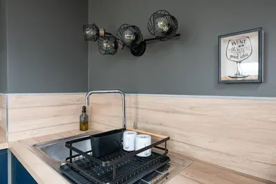 Cuisine ou kitchenette dans l'établissement Elégance Contemporaine