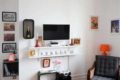 Télévision ou salle de divertissement dans l'établissement La Mignonette