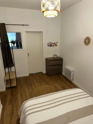 Un ou plusieurs lits dans un hébergement de l'établissement Casa Armando, beau F2, 2 places de parking clos, proche Disneyland