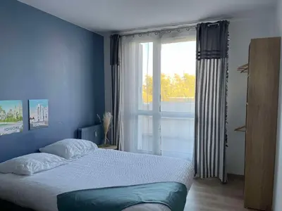 Un ou plusieurs lits dans un hébergement de l'établissement Duplex urbain spacieux à Compiègne