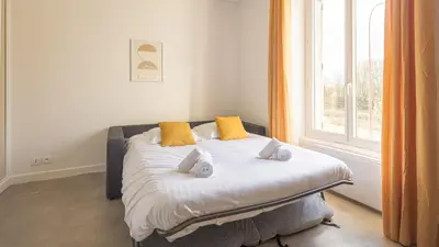 Un ou plusieurs lits dans un hébergement de l'établissement Sunshine - Appartement neuf - parking