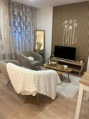 Télévision ou salle de divertissement dans l'établissement Appartement Cozy