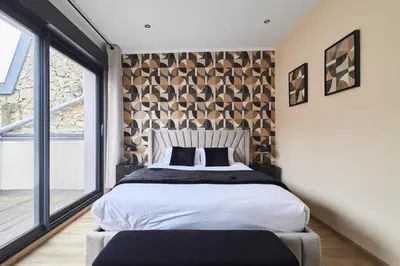 Un ou plusieurs lits dans un hébergement de l'établissement MM Suites Town House Terrasse