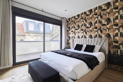 Un ou plusieurs lits dans un hébergement de l'établissement MM Suites Town House Terrasse