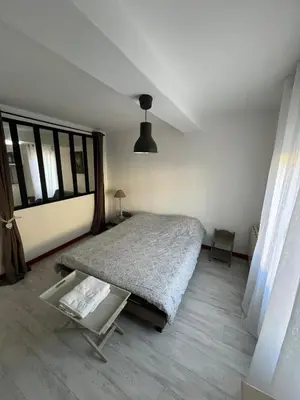 Un ou plusieurs lits dans un hébergement de l'établissement Appartement centre ville proche Roissy CDG