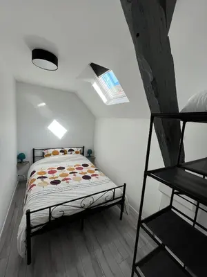 Un ou plusieurs lits dans un hébergement de l'établissement Charmant triplex, near Disney