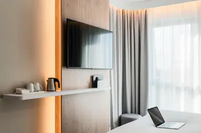 Télévision ou salle de divertissement dans l'établissement Holiday Inn Express & Suites Reims - Rives de Vesle by IHG