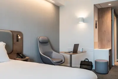 Un ou plusieurs lits dans un hébergement de l'établissement Holiday Inn Express & Suites Reims - Rives de Vesle by IHG
