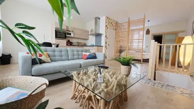 Coin salon dans l'établissement LÉchappée ZAisne jacuzzi et sauna