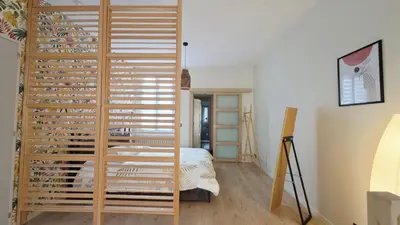 Un ou plusieurs lits dans un hébergement de l'établissement LÉchappée ZAisne jacuzzi et sauna
