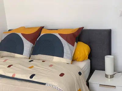 Un ou plusieurs lits dans un hébergement de l'établissement Chambres ou Appartement Cosy