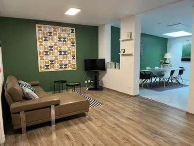 Télévision ou salle de divertissement dans l'établissement Suite K