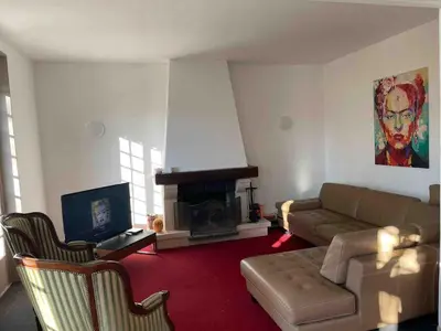 Coin salon dans l'établissement Grand Maison avec Piscine et Sauna