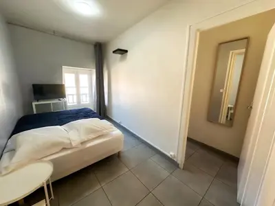 Un ou plusieurs lits dans un hébergement de l'établissement Studio SN8 - Centre-Ville Meaux - Proche Disneyland